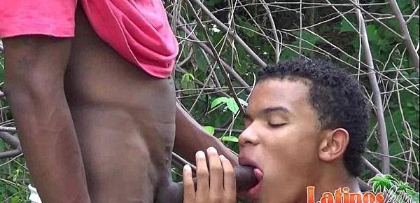  Two handsome Latinos tasting meat in the forest